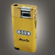 Ветроустойчива газова запалка Audi Заглавие на снимка: vetroustojchiva-gazova-zapalka-audi-gold Описание на снимка: Златна метална газова запалка с релефна повърхност и черни емблематични кръгове на автомобилната марка Audi.