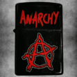 Черна бензинова запалка с червен, боядисан надпис ANARCHY и червеният символ "А в кръг" (Анархия).